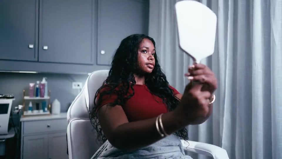 A customer at a beauty studio, from the WOI Beauty commercial